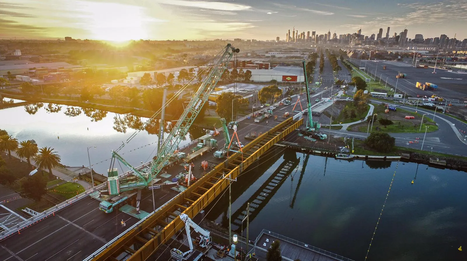 Aerial view of a Combo Constructions bridge and civil works site at sunrise